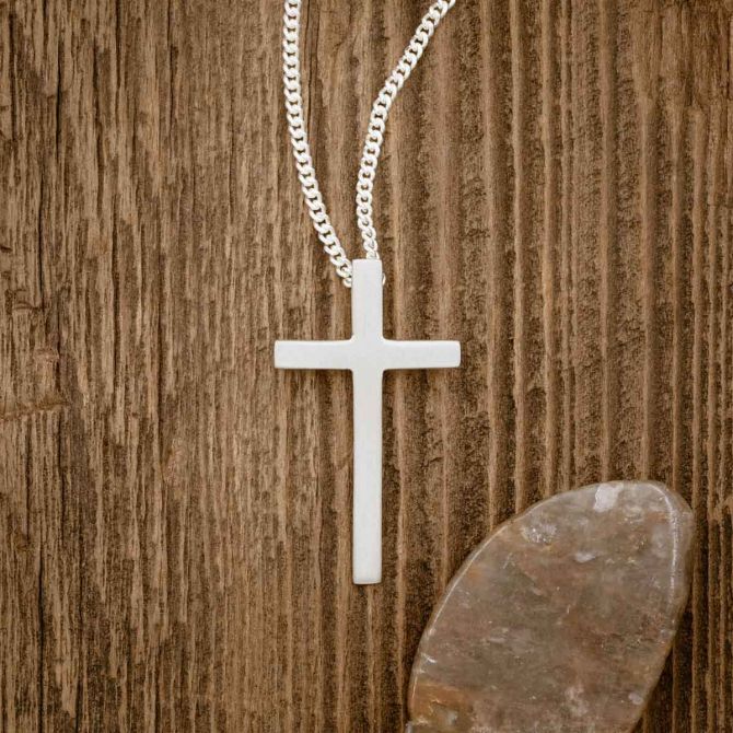 sterling silver Beloved Cross necklace, on wood background