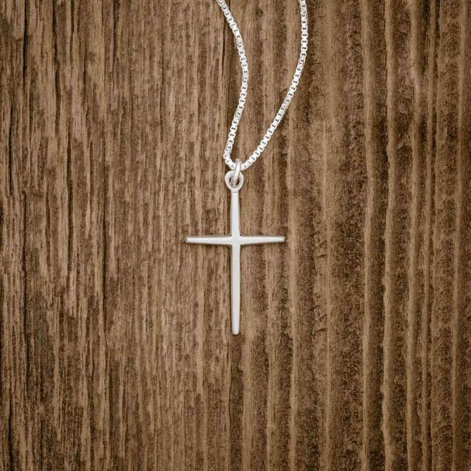 sterling silver Covenant of Love Cross necklace, on wood background
