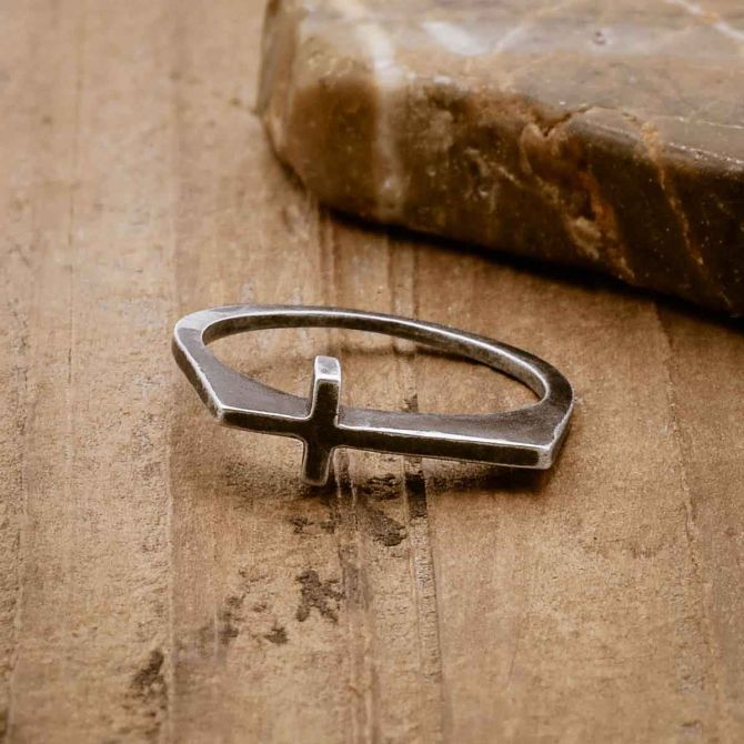 blackened sterling silver Dimensions Cross Ring, on wood background
