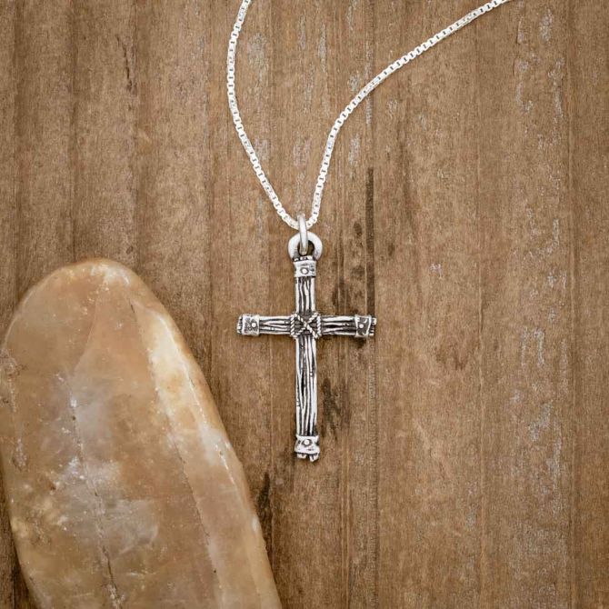 sterling silver Justified Cross Necklace, on wood background