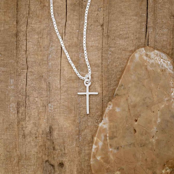 sterling silver Love & Accepted Cross necklace, on wood background