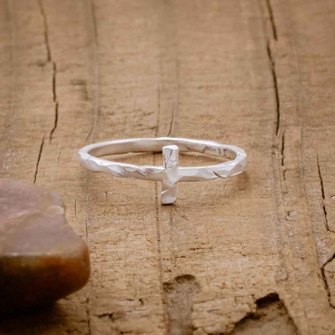 sterling silver Simple Hammered Cross Ring, on wood background