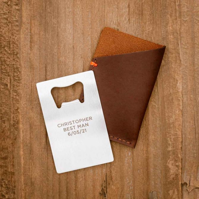 Personalized Trailblazer Bottle Opener and Leather Wallet on wood background