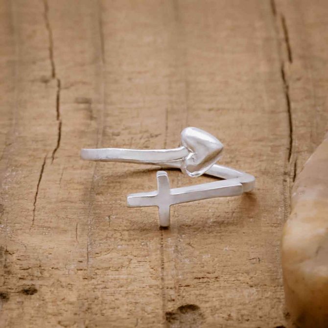 Sterling silver Wrapped in Christ’s Love Adjustable Cross Ring, on wood background