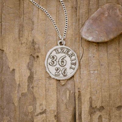 Ezekiel 36:26 Coin Necklace, handcrafted in sterling silver, on wood background