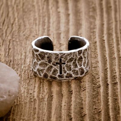 blackened sterling silver Hammered Cross Adjustable Ring, on wooden background