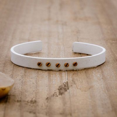 Resiliency cuff bracelet handcrafted in sterling silver with your choice of up to 6 bronze rivets