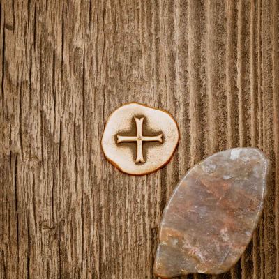 Personalized Bronze Roman Cross Coin Golf Ball Marker on wood background