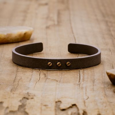 Resiliency black cuff bracelet handcrafted in sterling silver and sandblasted to a matte black finish with your choice of up to 6 bronze rivets