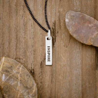 sterling silver Kairos Necklace with personalization, on wood background